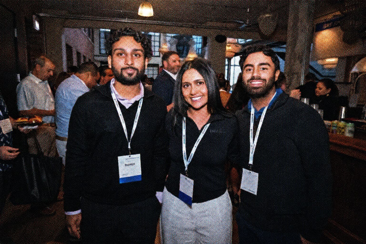 Halftone photograph of three Beagle team members at a Chicago real estate industry event