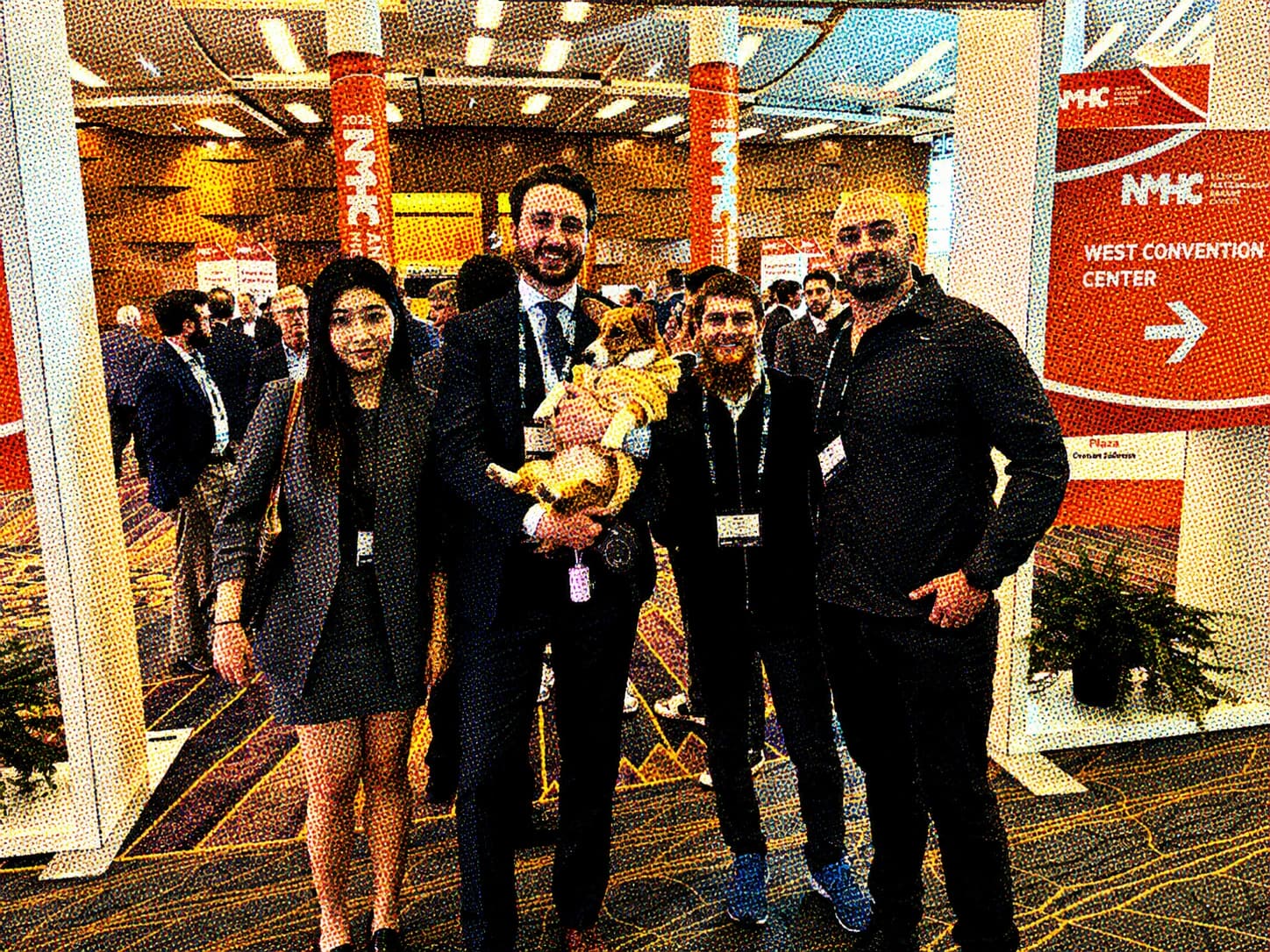 Halftone photograph of Beagle team members and Trudy the corgi at the NMHC conference